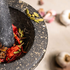 Umamai-ingredients-ground-in-motar-pestle